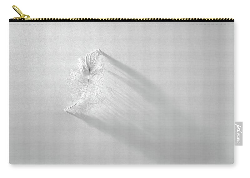 Feather Zip Pouch featuring the photograph White Feather by Scott Norris