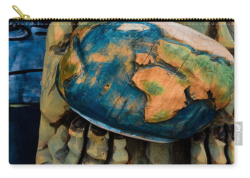 Alien Zip Pouch featuring the photograph Whole World in his Hands by Bonny Puckett