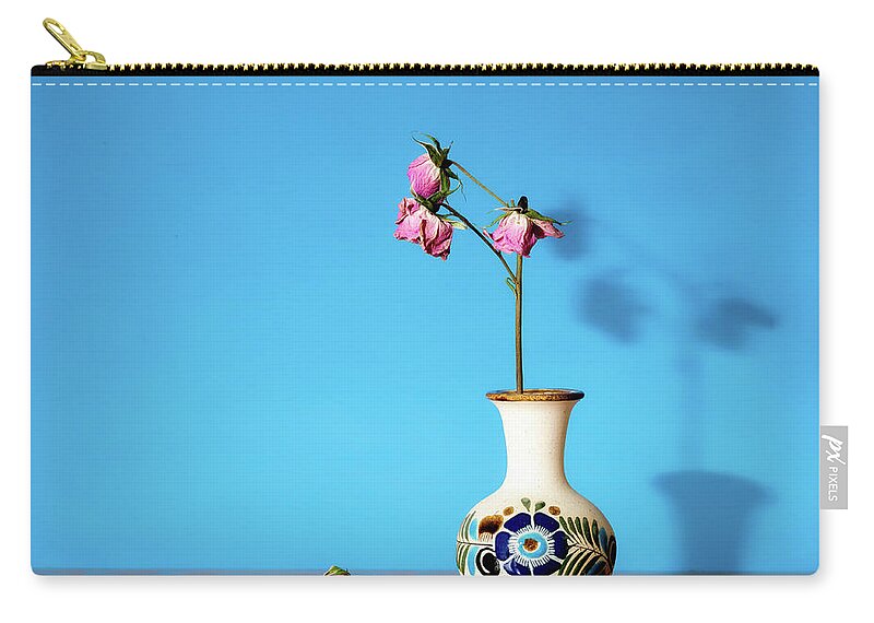 Still Life Zip Pouch featuring the photograph Wilted roses against blue by Alessandra RC