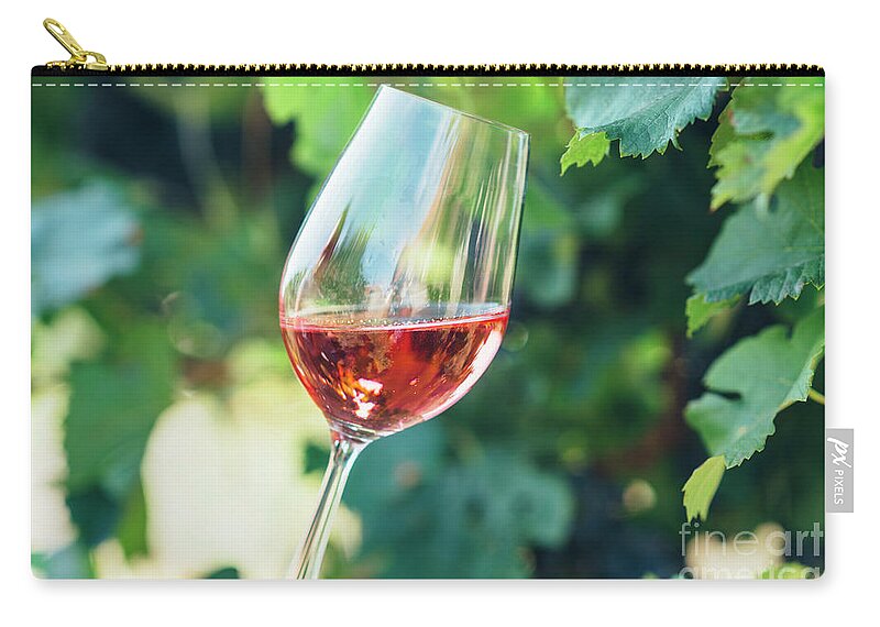 Wine Zip Pouch featuring the photograph Wine tasting in outdoor winery. by Jelena Jovanovic
