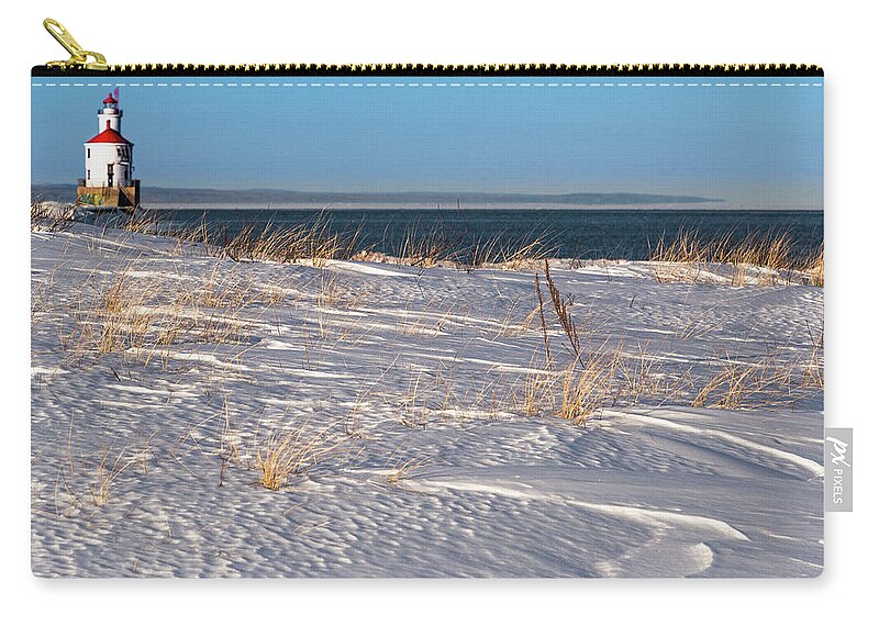 Lighthouse Zip Pouch featuring the photograph Winter at Wisconsin Point by Joe Kopp