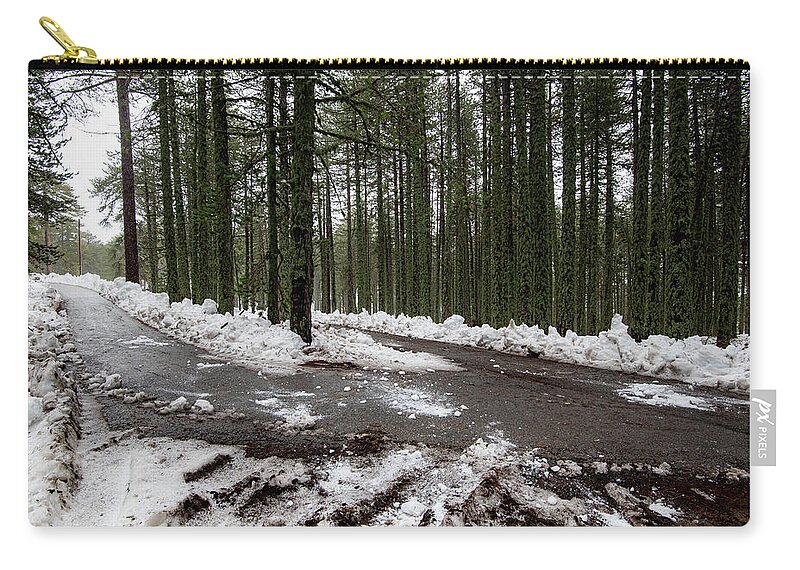 Wintertime Carry-all Pouch featuring the photograph Winter forest landscape with snow on the ground by Michalakis Ppalis