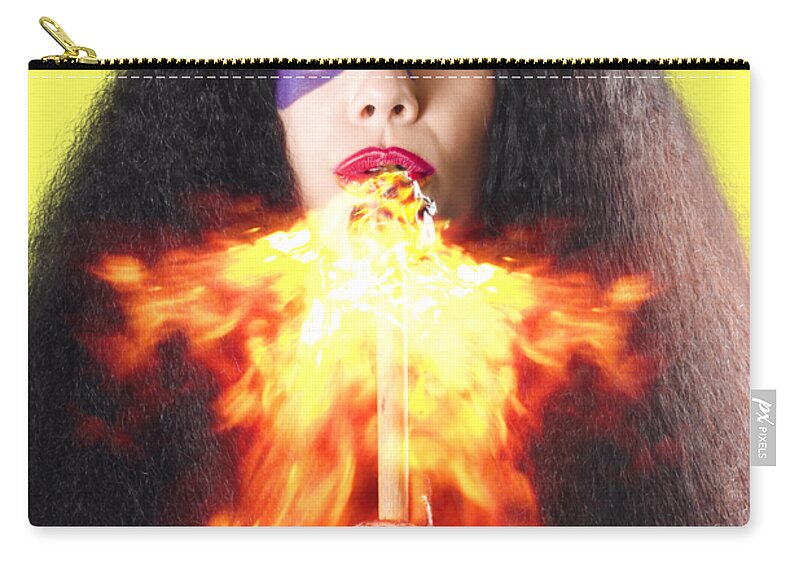 Fire Zip Pouch featuring the photograph Woman breathing fire from mouth by Jorgo Photography