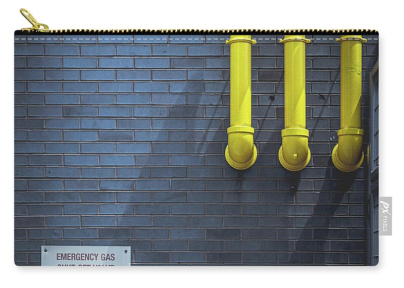 Yellow Pipes Zip Pouch featuring the photograph yellow pipes - Queens, NY by Steve Stanger