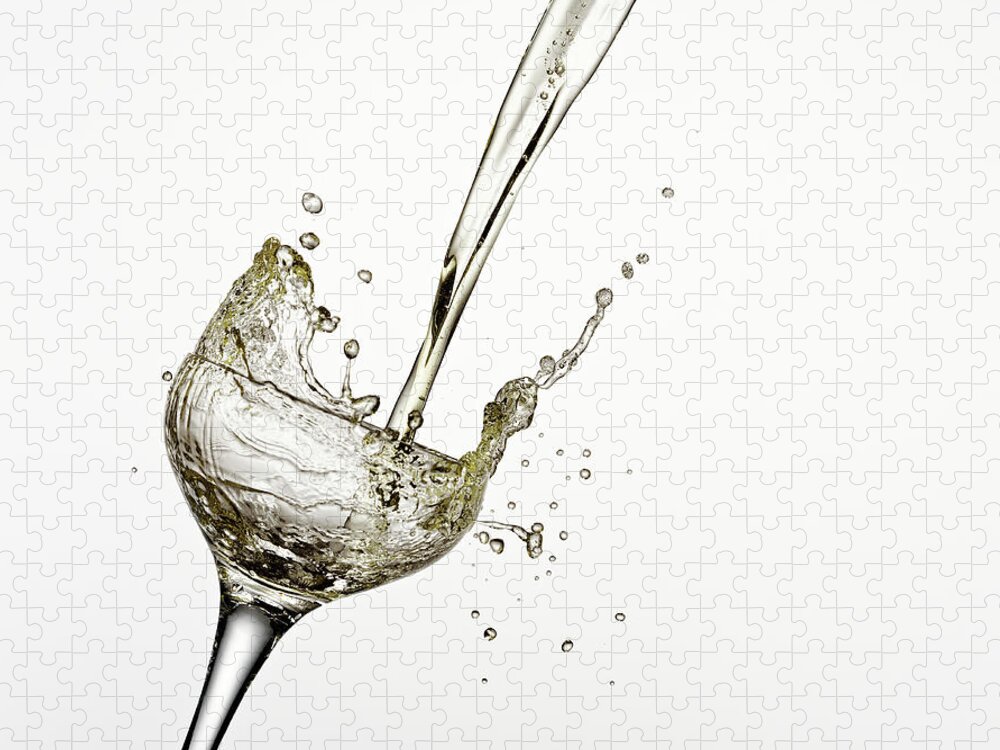 White Background Jigsaw Puzzle featuring the photograph Champagne Being Poured Into Glass #1 by Andy Roberts
