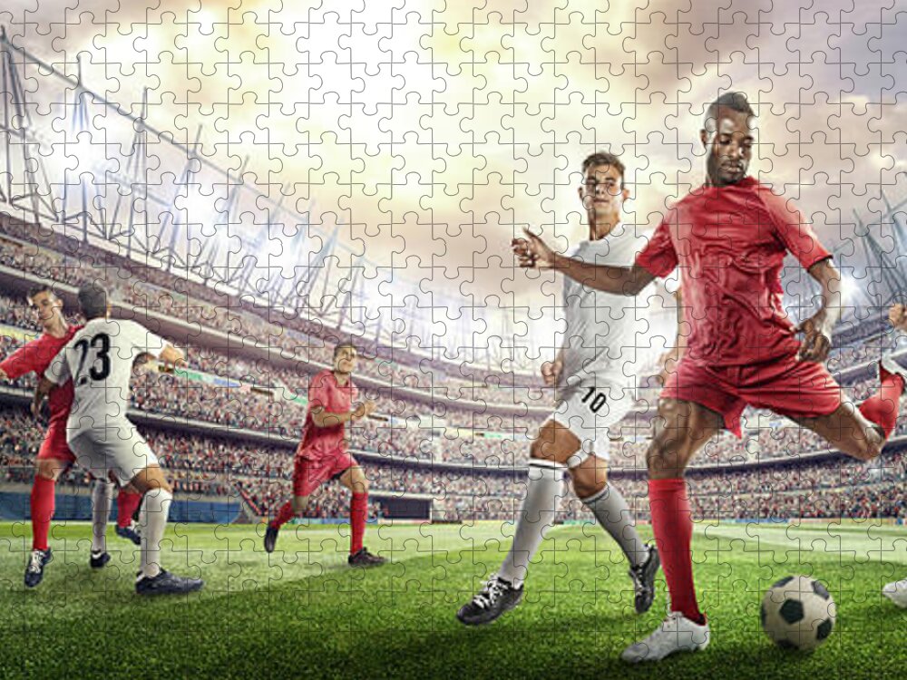 Soccer Uniform Jigsaw Puzzle featuring the photograph Soccer Player Kicking Ball In Stadium by Dmytro Aksonov