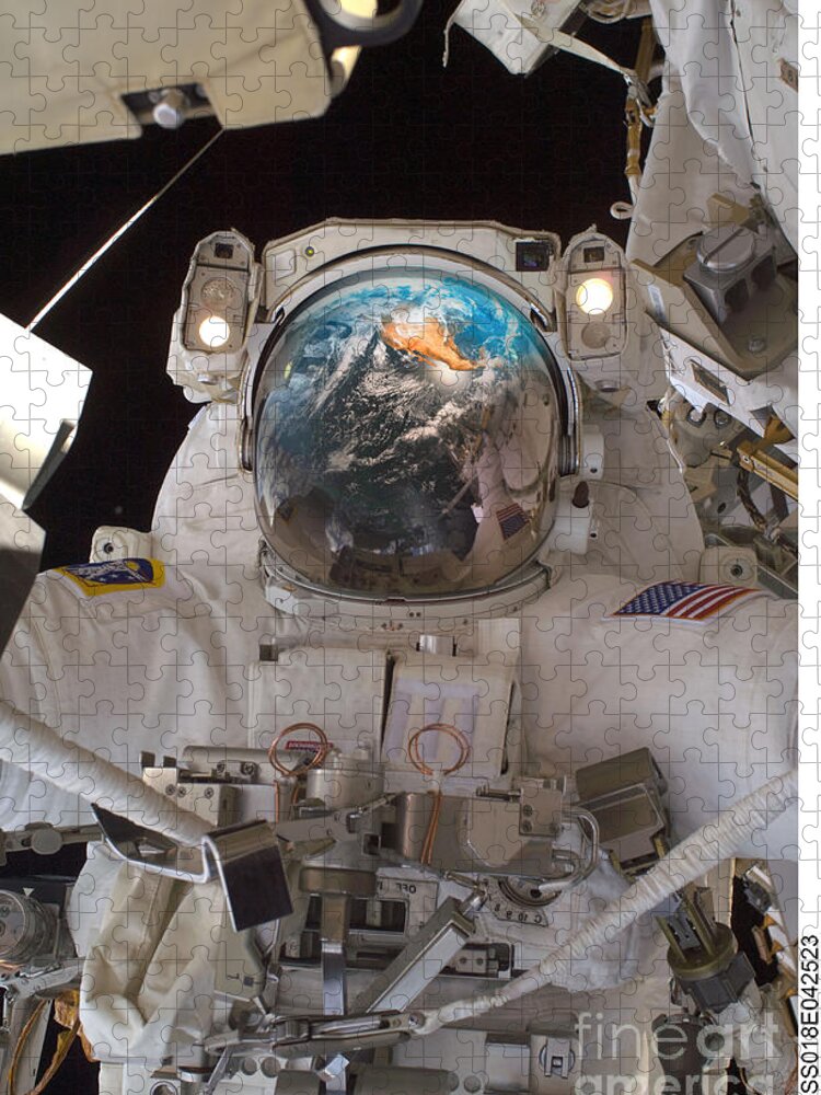 Reflection Jigsaw Puzzle featuring the photograph Astronaut With Earth Reflection by Mike Agliolo