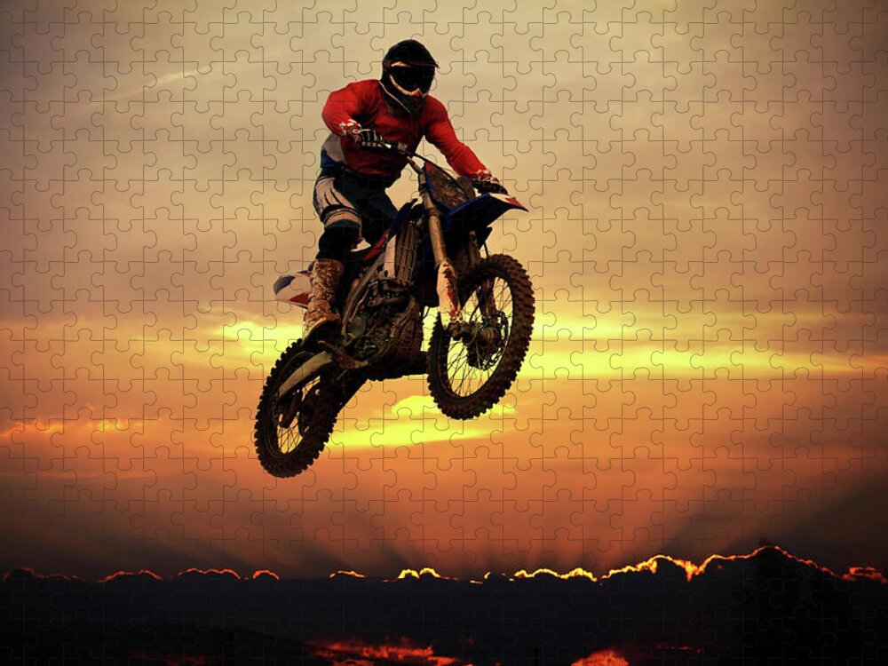 Crash Helmet Jigsaw Puzzle featuring the photograph Biker On Motorcycle Jumping Over Clouds by Sergiy Trofimov Photography