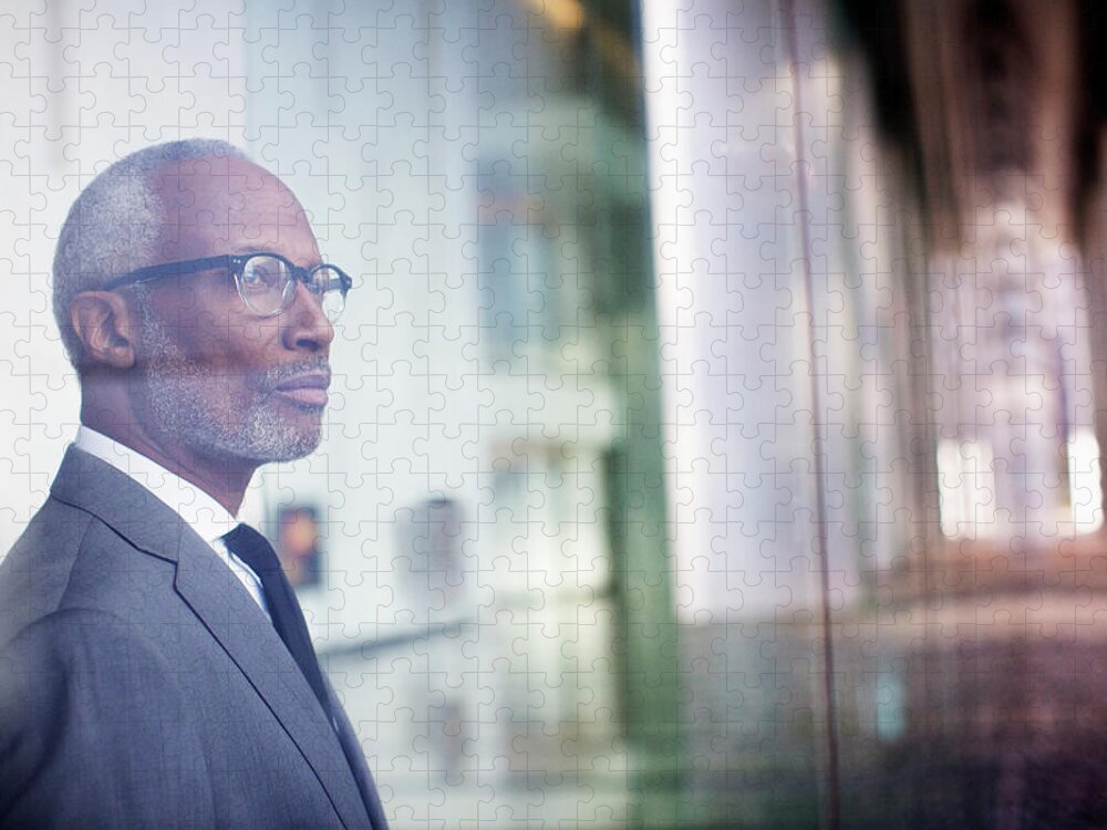 Corporate Business Jigsaw Puzzle featuring the photograph Black Businessman Looking Out Window by Hill Street Studios Llc