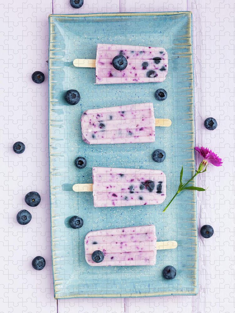 In A Row Jigsaw Puzzle featuring the photograph Blueberry Yogurt With Candy On Tray by Westend61