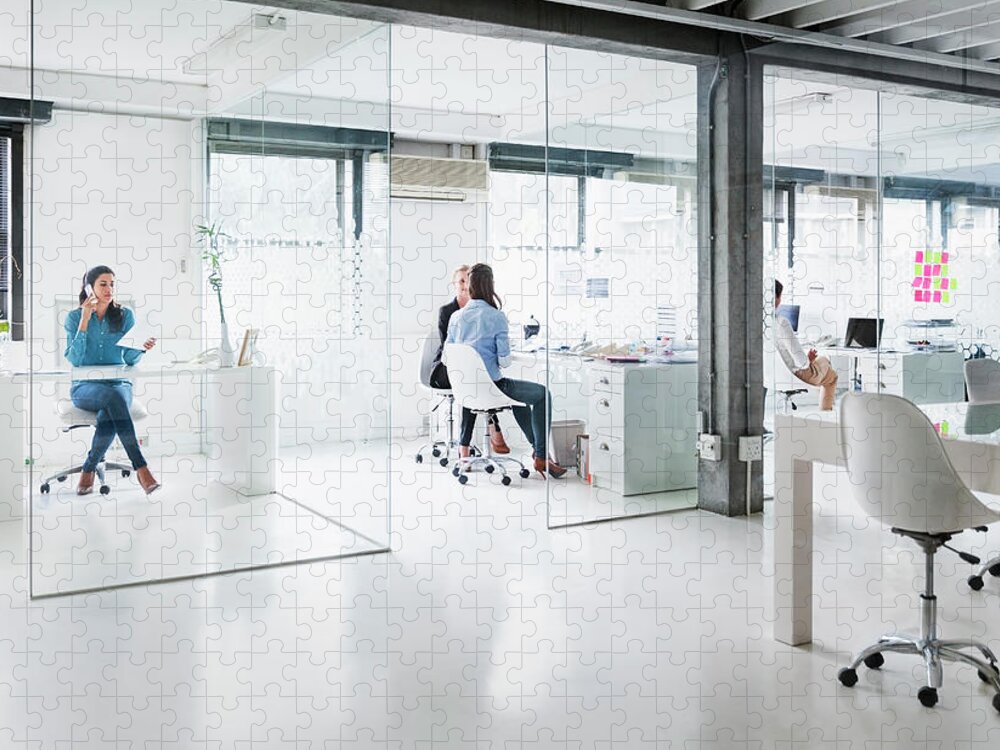 Working Jigsaw Puzzle featuring the photograph Bright Modern Office Space With Four by Portra