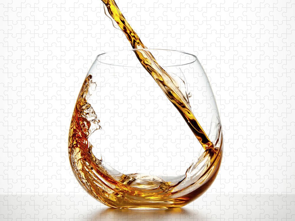 White Background Jigsaw Puzzle featuring the photograph Brown Liquor Streaming Into A Glass by Chris Stein