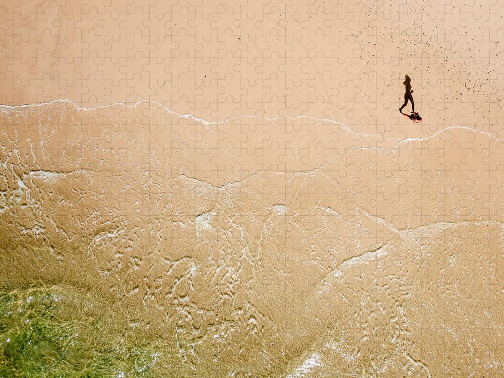 Pixels Jigsaw Puzzle featuring the photograph Jogger on Tallow Beach. Byron Bay. Australia. by Rob Huntley