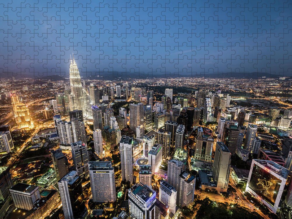 Built Structure Jigsaw Puzzle featuring the photograph Kuala Lumpur Skyline At Dusk,elevated by Martin Puddy