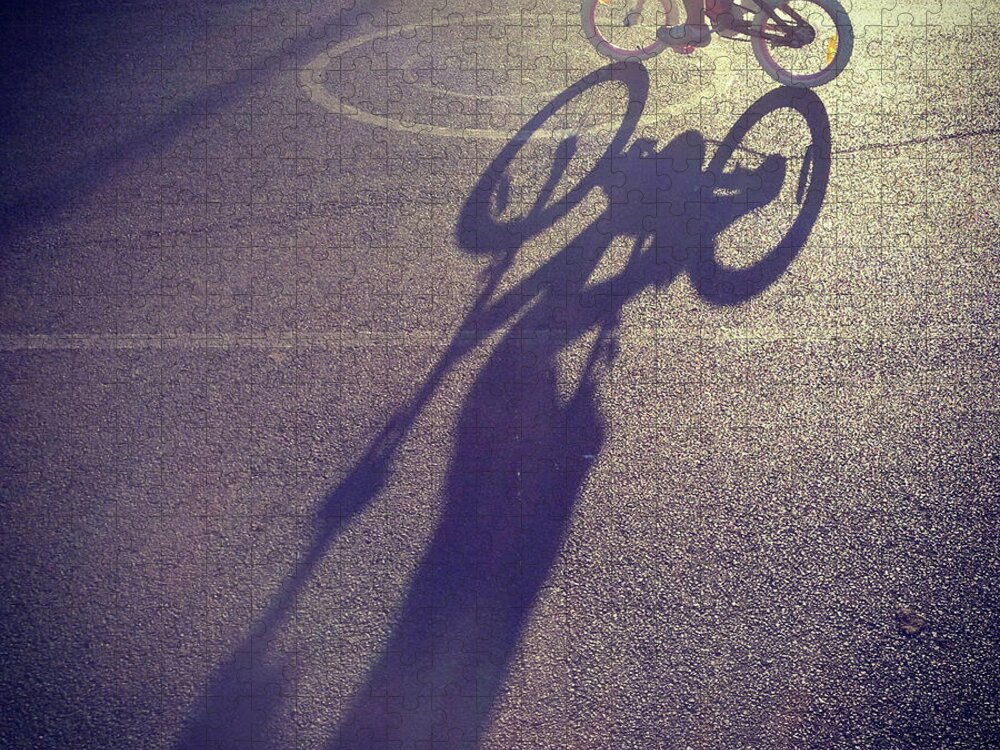 Shadow Jigsaw Puzzle featuring the photograph Long Shadow Of Child Riding A Bicycle by Jodie Griggs