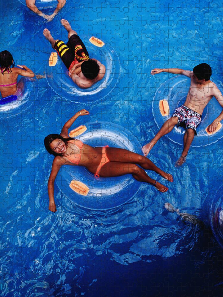 People Jigsaw Puzzle featuring the photograph People Floating In Pool On Rubber Rings by Richard I'anson