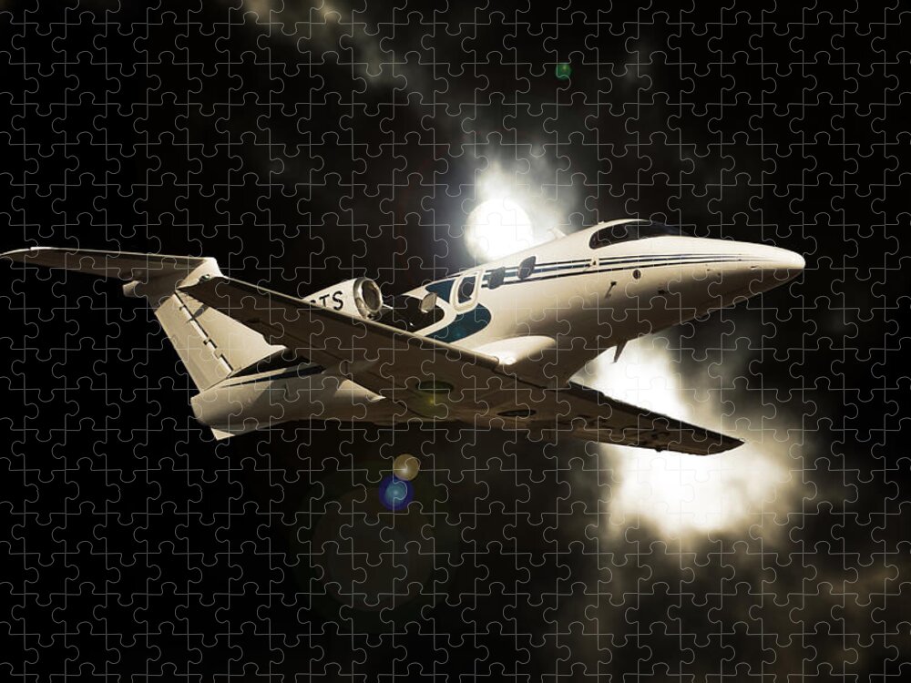 Embraer Phenom 100 Jigsaw Puzzle featuring the photograph Phenom Light by Paul Job