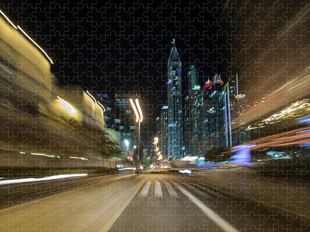 Downtown District Jigsaw Puzzle featuring the photograph Pov Of A Car Driving Nights In Dubai by Emanuel M Schwermer