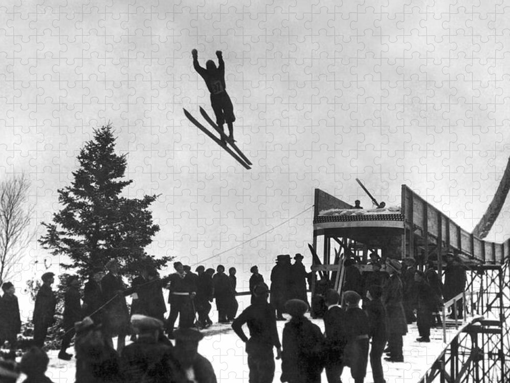 1922 Jigsaw Puzzle featuring the photograph Skier Off A Jump by Underwood Archives