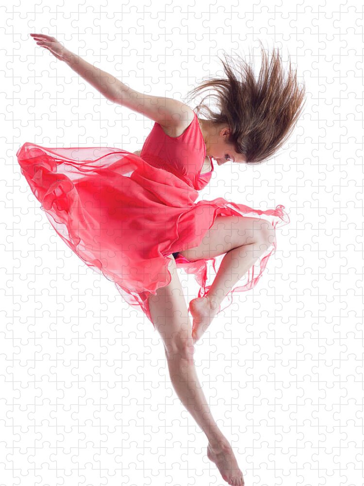 Ballet Dancer Jigsaw Puzzle featuring the photograph The Dancer In Midair Isolated On White by Proxyminder