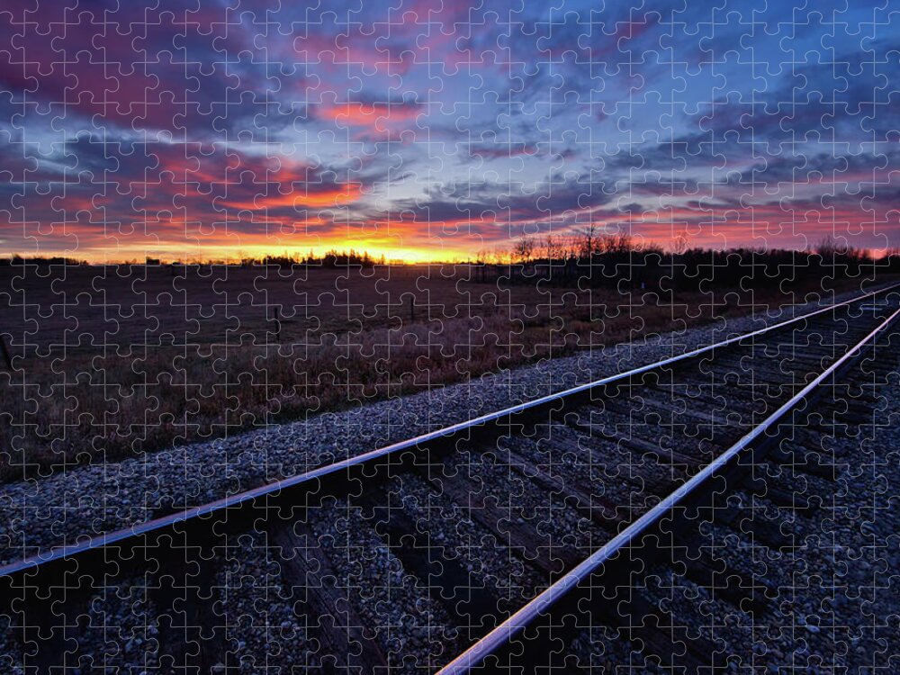 Rail Transportation Jigsaw Puzzle featuring the photograph Train Tracks And A Dramatic Colourful by John Kroetch / Design Pics