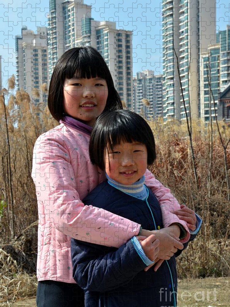 Girls Jigsaw Puzzle featuring the photograph Two Chinese teen sisters hug and embrace Shanghai China by Imran Ahmed