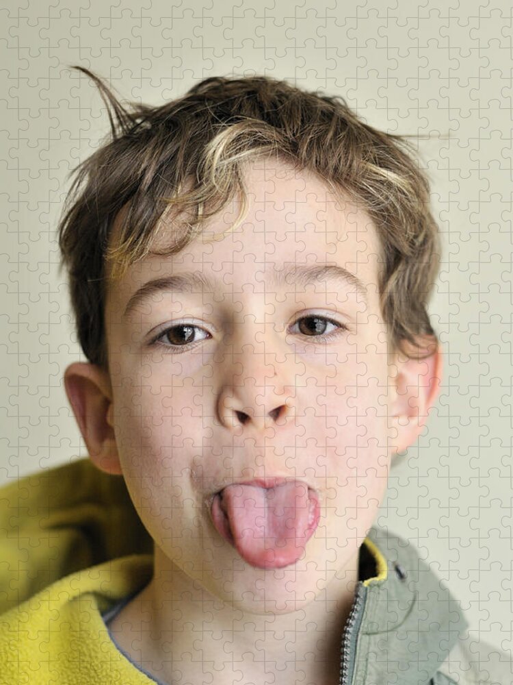 Stick Tongue Out Jigsaw Puzzle featuring the photograph Boy pokes his tongue out by Matthias Hauser