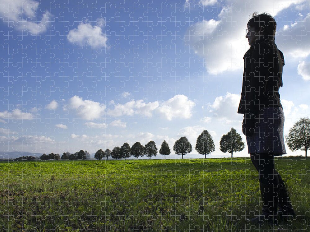 Person Jigsaw Puzzle featuring the photograph Landscape with row of trees and person by Matthias Hauser
