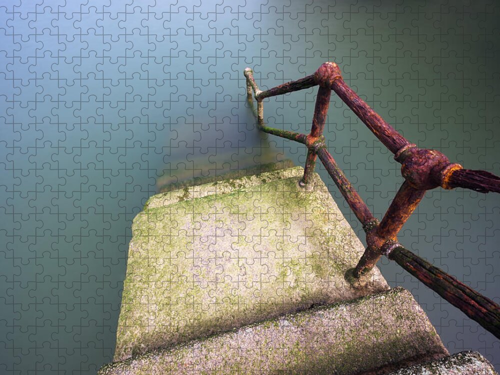 Railing Jigsaw Puzzle featuring the photograph Rusty Handrail Going Down On Water #2 by Mikel Martinez de Osaba