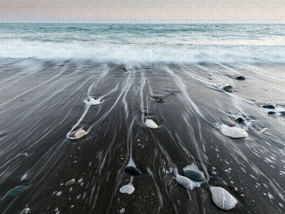 Seascape Jigsaw Puzzle featuring the photograph Pebbles in the beach and flowing sea water by Michalakis Ppalis