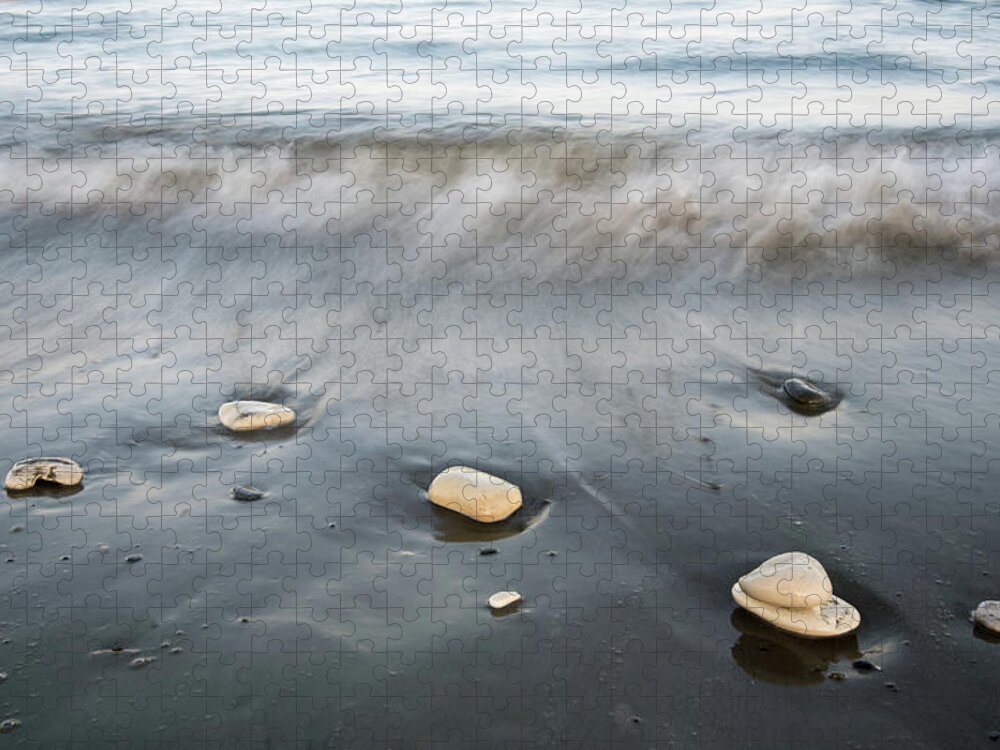 Coastline Jigsaw Puzzle featuring the photograph Pebbles in the beach and flowing sea water by Michalakis Ppalis