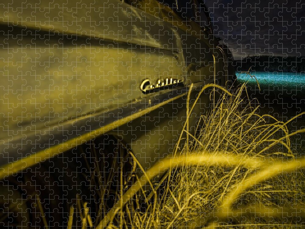 Cadillac Jigsaw Puzzle featuring the photograph 50's Cadillac logo at night in yellow light by a cornfield by Sven Brogren