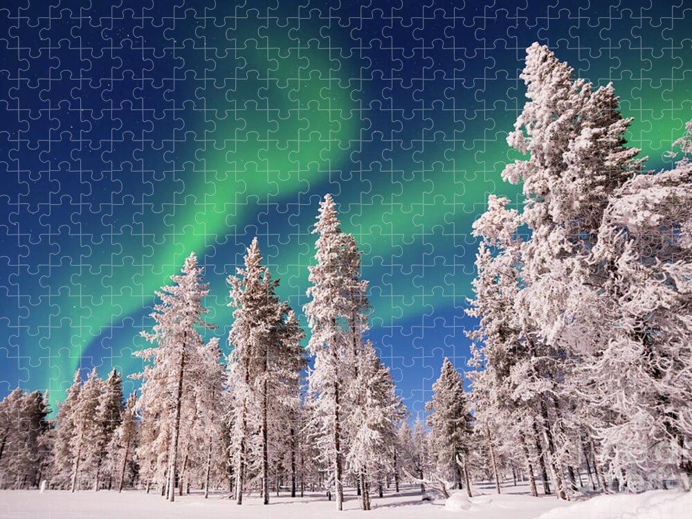 Northern Lights Jigsaw Puzzle featuring the photograph Aurora Borealis, Northern lights over snowy pine trees by Delphimages Photo Creations