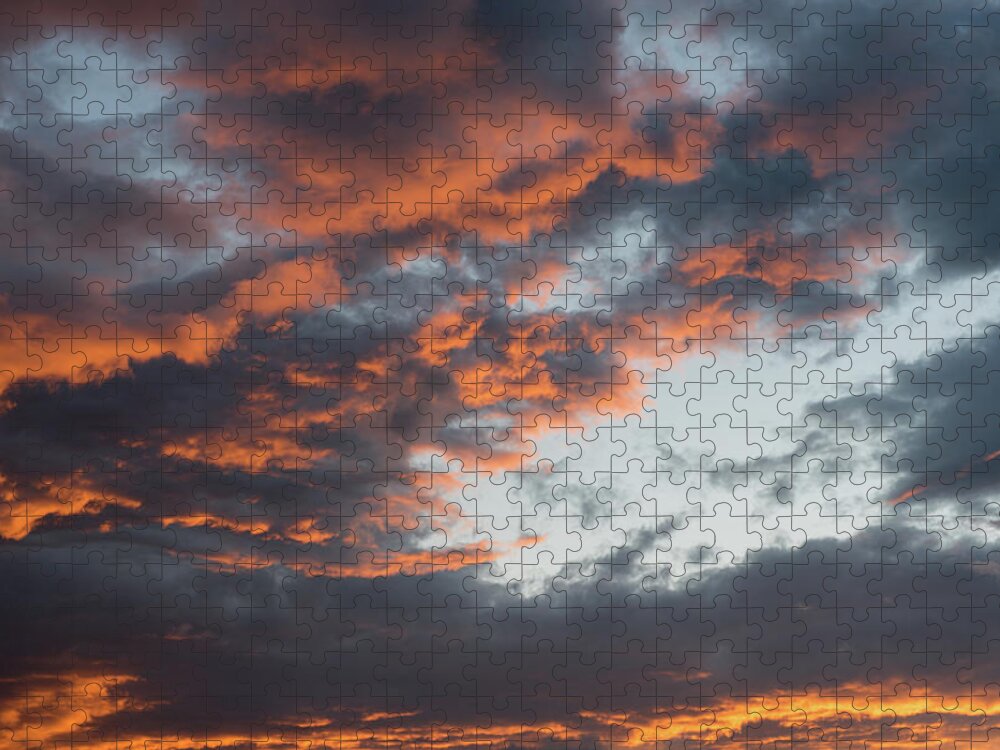 Stormy Clouds Jigsaw Puzzle featuring the photograph Dramatic sunset sky with orange cloud colors by Michalakis Ppalis