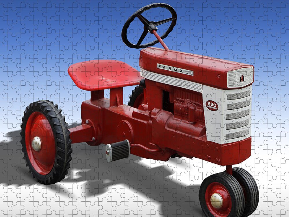 Farmall Jigsaw Puzzle featuring the photograph Farmall Peddle Tracter by Mike McGlothlen
