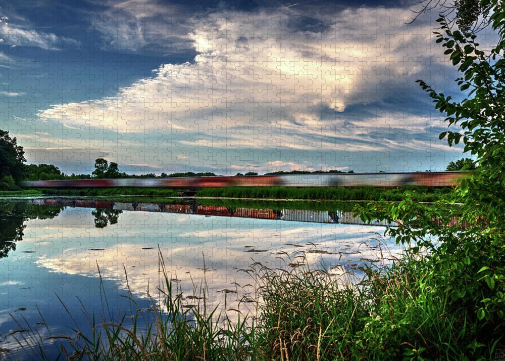 Train Blurred Lake Clouds Reflection Blue Green Horizontal Evansville Wi Wisconsin Lake Leota Leota Park Jigsaw Puzzle featuring the photograph Frozen Reflections by Peter Herman