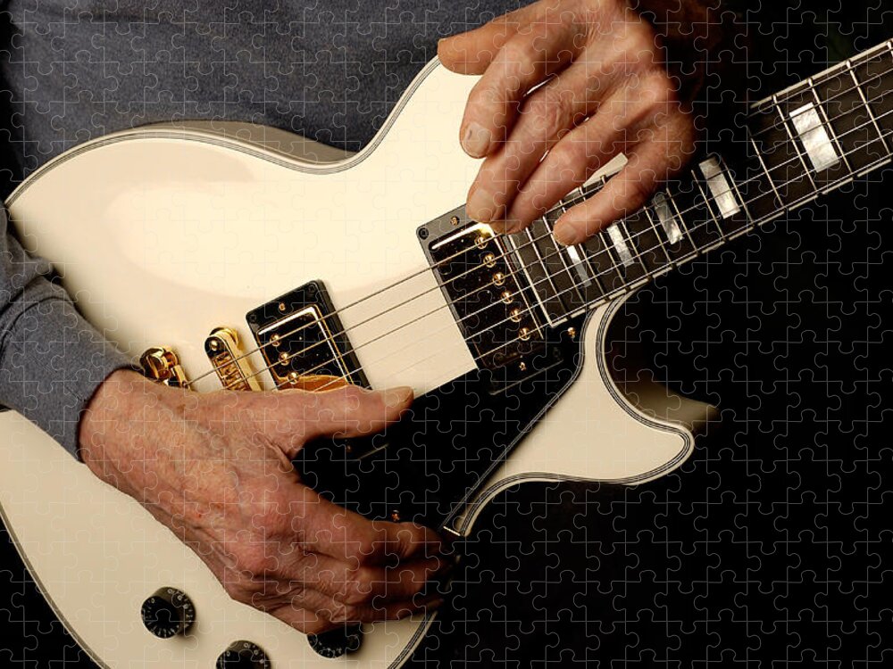 Les Paul Jigsaw Puzzle featuring the photograph Les Paul's hands holding his white gibson Les Paul custom guitar by Gene Martin by David Smith