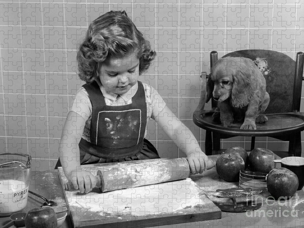 1950s Jigsaw Puzzle featuring the photograph Little Girl Baking As Puppy Looks On by H. Armstrong Roberts/ClassicStock
