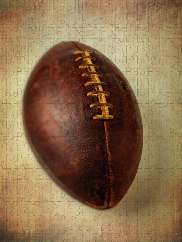 Old Jigsaw Puzzle featuring the photograph Old Worn Football by Garry Gay