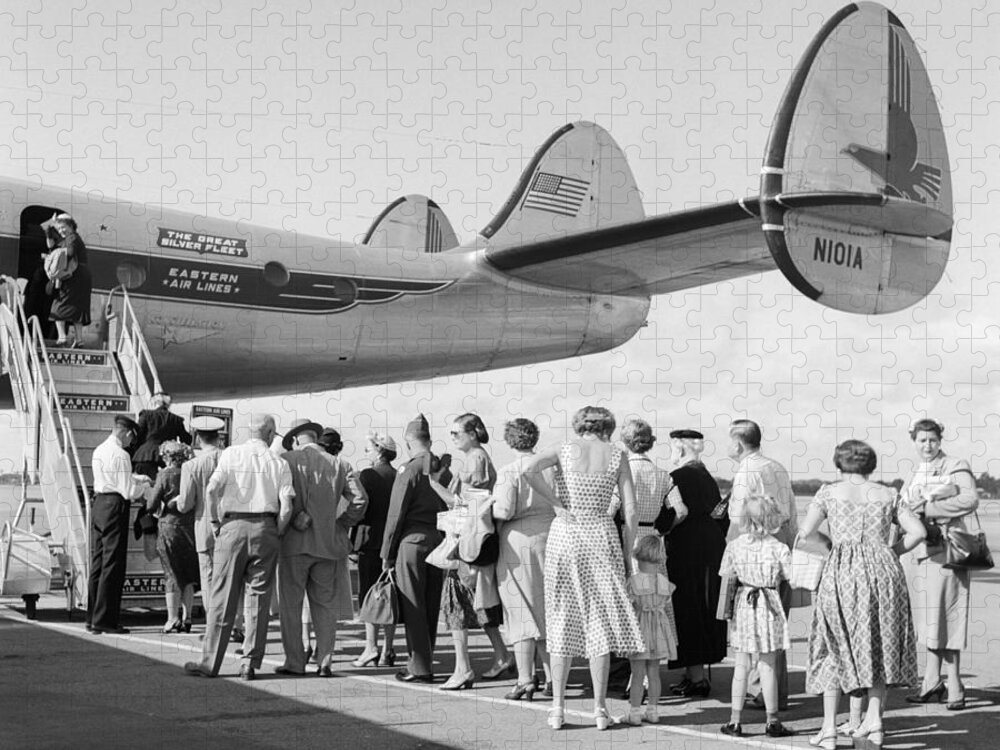 1950s Jigsaw Puzzle featuring the photograph Passengers Boarding A Plane by C.S. Bauer/ClassicStock