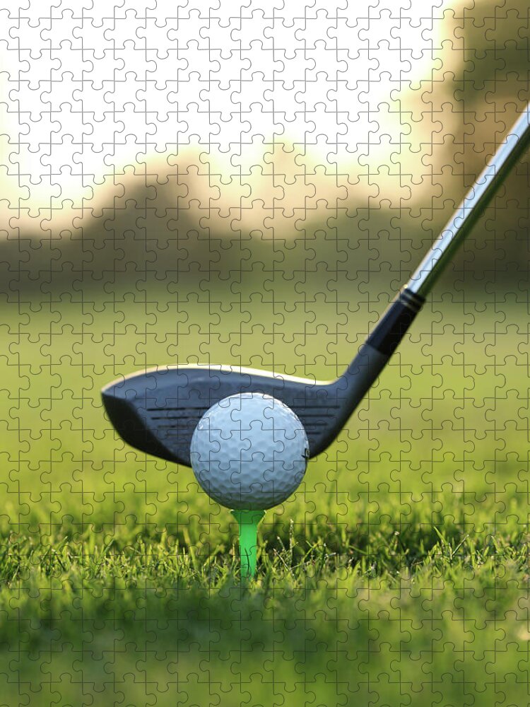 Grass Jigsaw Puzzle featuring the photograph Close Up Of Golf Ball And Club On Course #1 by Visage