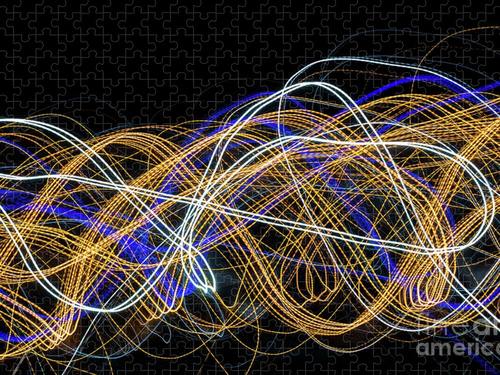 Abstract Jigsaw Puzzle featuring the photograph Colorful light painting with circular shapes and abstract black background. #1 by Joaquin Corbalan
