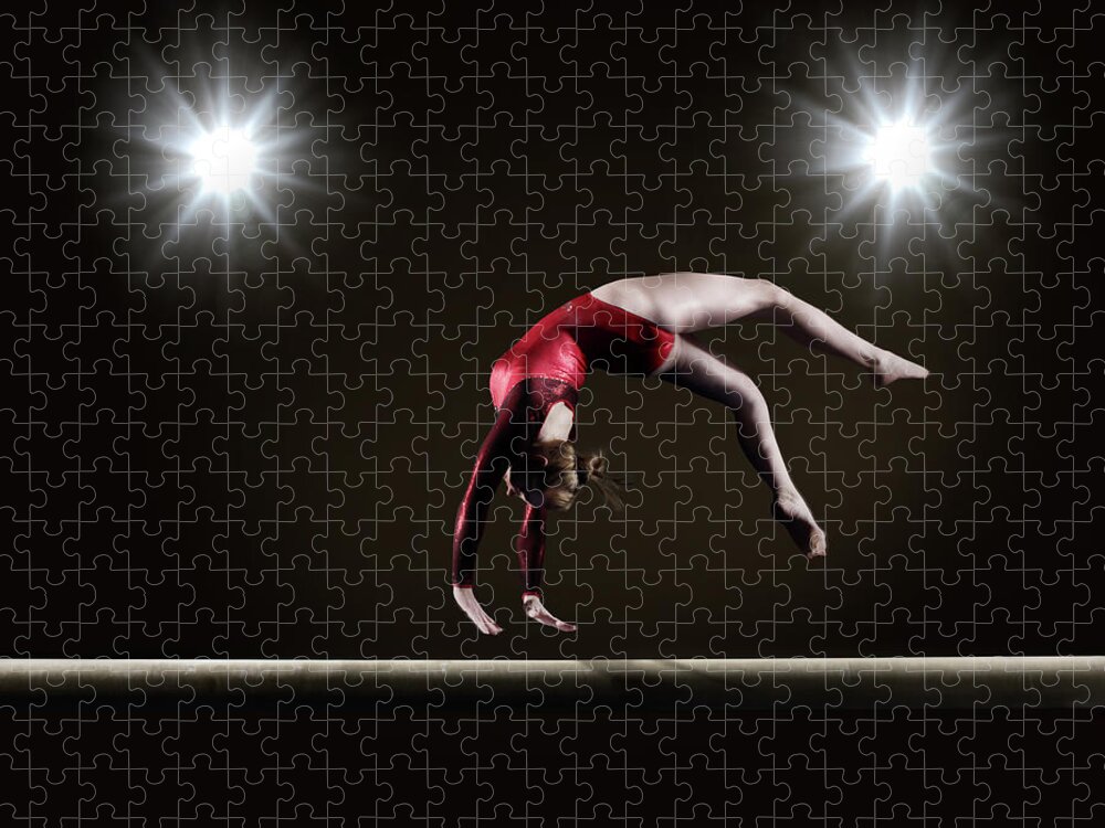 Expertise Jigsaw Puzzle featuring the photograph Female Gymnast On Balance Beam #1 by Mike Harrington