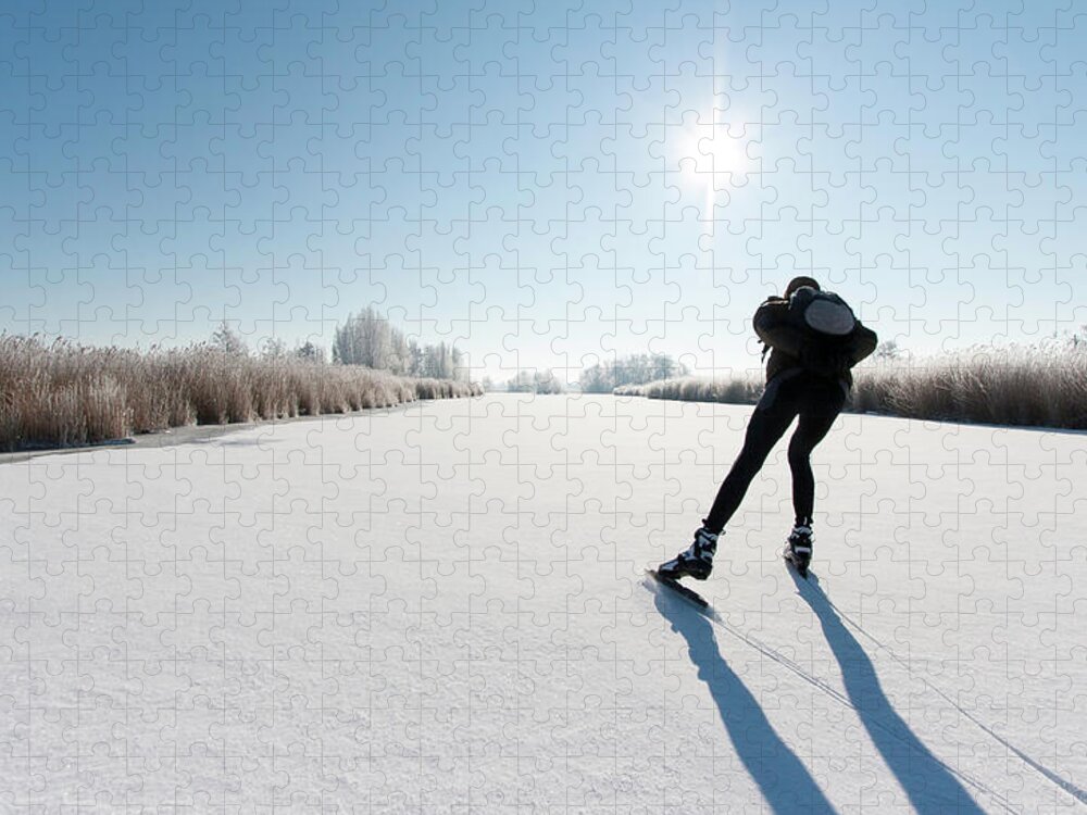 Scenics Jigsaw Puzzle featuring the photograph Ice Skating #1 by Jaap-willem