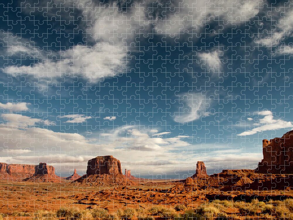 Scenics Jigsaw Puzzle featuring the photograph Monument Valley With Dramatic Clouds #1 by Russell Burden