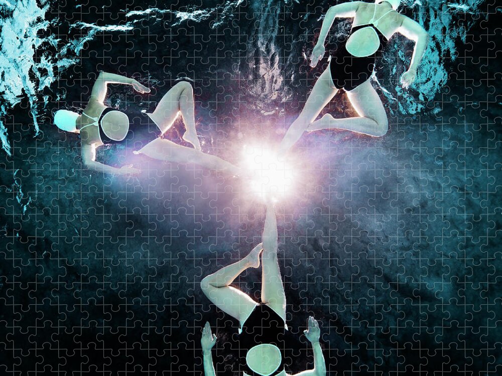 Underwater Jigsaw Puzzle featuring the photograph Three Synchronised Swimmers In Formation #1 by Henrik Sorensen