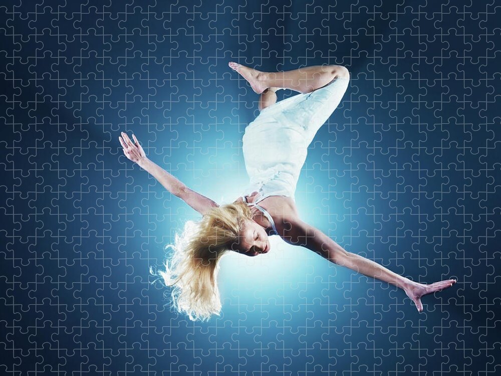 Stage Costume Jigsaw Puzzle featuring the photograph Young Woman In Air, Low Angle View #2 by Henrik Sorensen