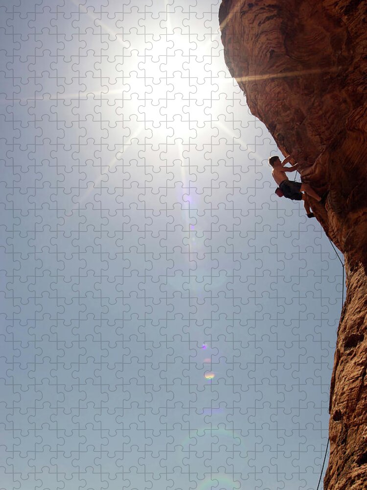 Recreational Pursuit Jigsaw Puzzle featuring the photograph A Rock Climber Ascends A Red Rock Face #28 by Jared Mcmillen