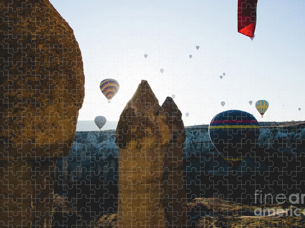 Adventure Jigsaw Puzzle featuring the photograph hot air balloons for tourists flying over rock formations at sunrise in the valley of Cappadocia. #4 by Joaquin Corbalan
