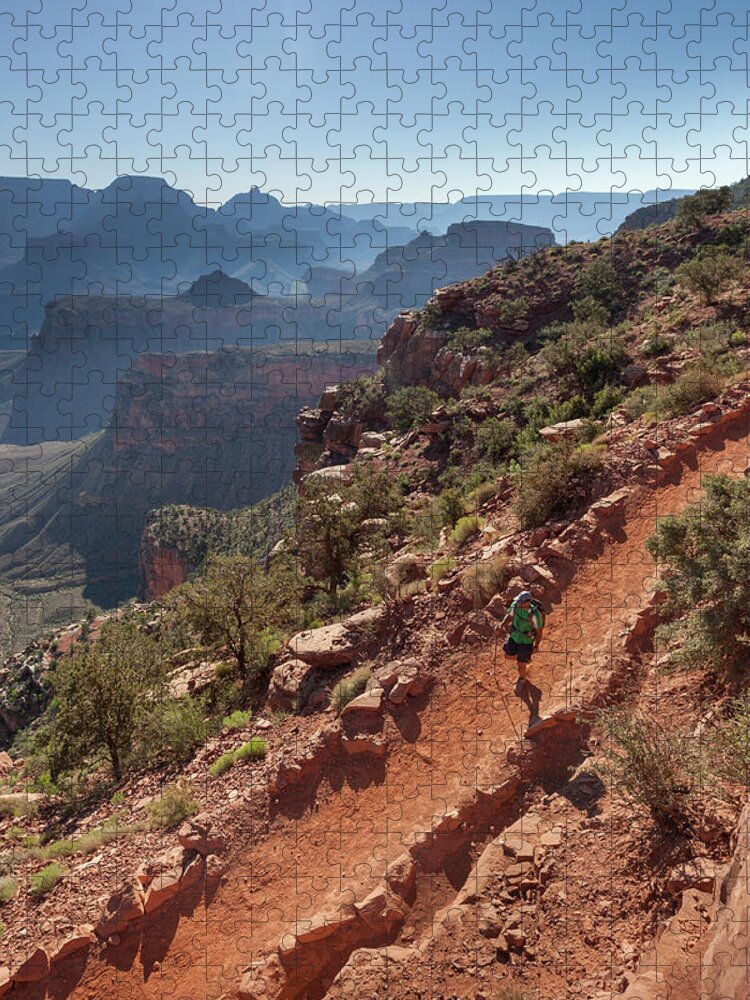 Tranquility Jigsaw Puzzle featuring the photograph A Man Hiking On A Trail With Canyons In by Whit Richardson